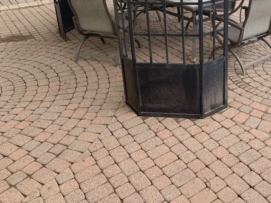 The same paver patio after cleaning by Bronny's Power Washing, with the warm red brick colour restored.